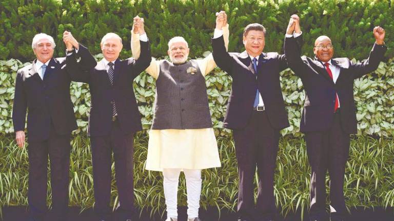 If India and China can reset their relationship, this will provide a model of conflict resolution and peaceful coexistence for members of BRICS. – AFPPIX