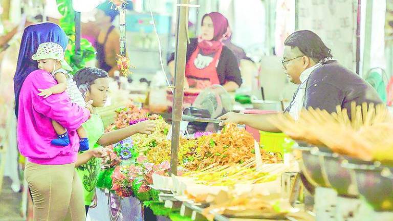 Getting children involved in food preparation and grocery shopping also makes healthy eating fun and educational. – Adib Rawi Yahya/THESUN