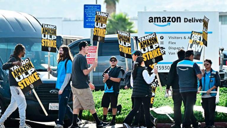 Amazon workers walk the picket line outside an Amazon facility in the City of Industry, California on December 19, 2024. AFPpix