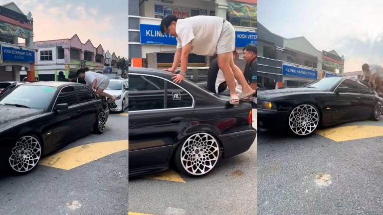 Modified BMW gets stranded on speed bump, unusual “CPR” attempt fails to revive it