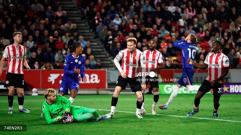Chelsea's English midfielder #10 Cole Palmer (2R) reacts after Brentford's Irish goalkeeper #01 Caoimhin Kelleher (2L) saves his shot during the English Premier League football match between Brentford and Chelsea at the Gtech Community Stadium in London on September 13, 2025. - AFP