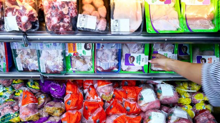 A consumer buys chicken at a local market, in Montenegro, Brazil May 17, 2025. - REUTERSPIX