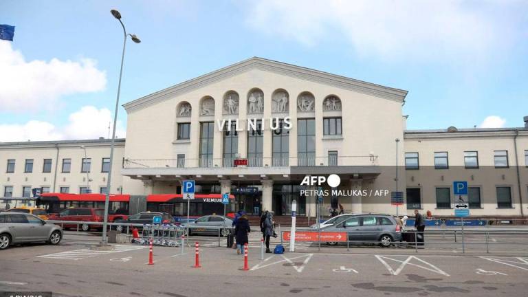 Travellers arrive at Vilnius Airport, in Lithuania, on March 14, 2020. Lithuanian airports started sanitary controls to limit the spread of the novel coronavirus. - AFP