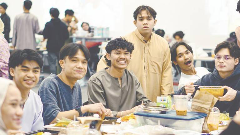 Malaysian students at Penn State University enjoying themselves at an iftar gathering.