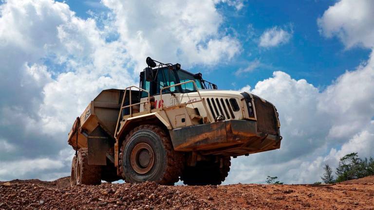 FILE PHOTO: A truck passes through a tin mining area of Indonesia’s PT Timah in Pemali, Bangka island, Indonesia, July 25, 2019. REUTERS/Fransiska Nangoy/File Photo