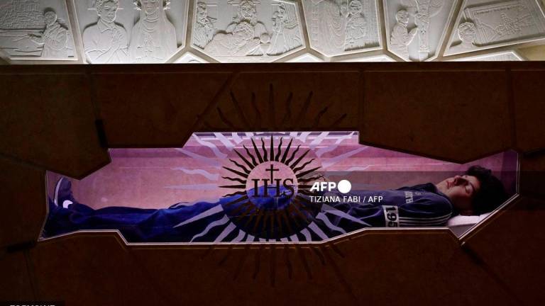 A picture shows the tomb of Blessed Carlo Acutis, an adolescent who spent his life spreading his faith online, earning the moniker God's Influencer, in the Shrine of the Renunciation in Assisi, part of the Church of Saint Mary Major, on April 3, 2025. - AFP