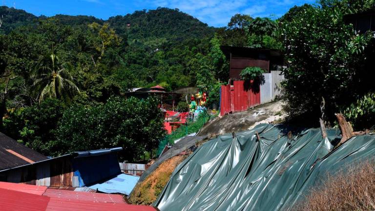 Kawasan tanah runtuh di kawasan cerun berhampiran kediaman penduduk di Jalan Paya Terubong pada 21 Ogos lalu- BERNAMA