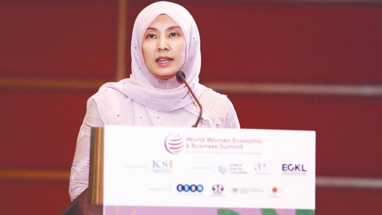 Nurul Izzah delivering her keynote address at World Women Economic and Business Summit 2025.