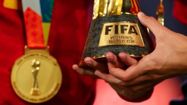 Football - FIFA Women's World Cup Australia and New Zealand 2023 - Final - Spain v England - Stadium Australia, Sydney, Australia - August 20, 2023General view of a Spain player holding the World Cup trophy after the match - REUTERSPIX