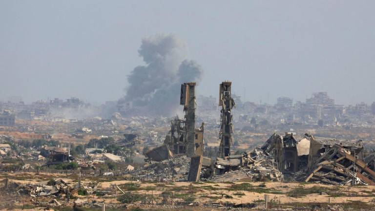 Smoke rises following explosions in Gaza City after Hamas agreed to release hostages and accept some other terms in a U.S. plan to end the war, as seen from central Gaza Strip October 4, 2025. REUTERS/Dawoud Abu Alkas