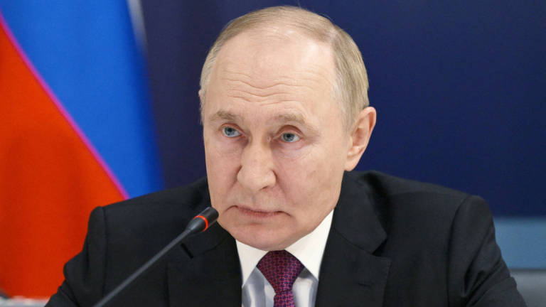 Russian President Vladimir Putin takes part in a video link to observe major naval drills, which are conducted by the Russian Navy in the Pacific and Arctic oceans and in the Baltic and Caspian seas, during his visit to the Admiralty in Saint Petersburg, Russia, July 27, 2025. - Pool via REUTERS