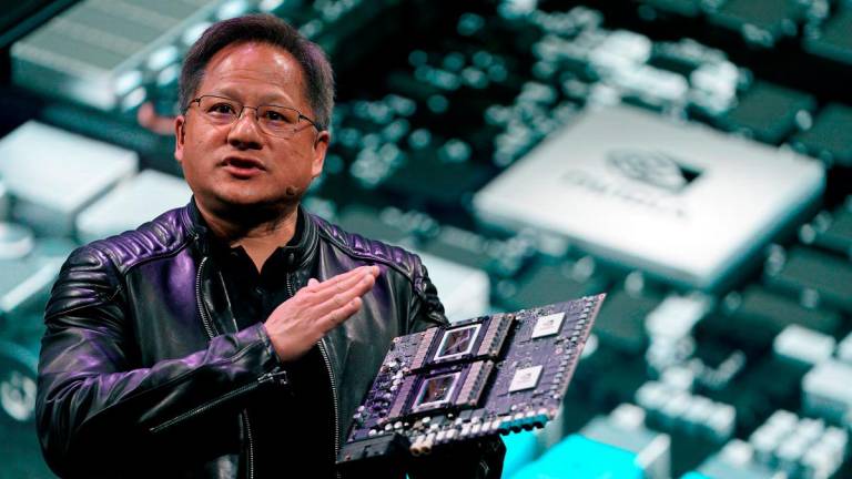 - Jensen Huang, CEO of Nvidia, shows the Drive Pegasus robotaxi AI computer at his keynote address at CES in Las Vegas, Nevada, U.S. January 7, 2018. REUTERS/Rick Wilking