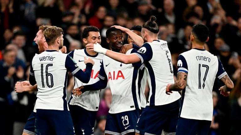 Tottenham Hotspur's Pape Matar Sarr celebrates scoring their second goal with teammates. - REUTERS/Dylan Martinez