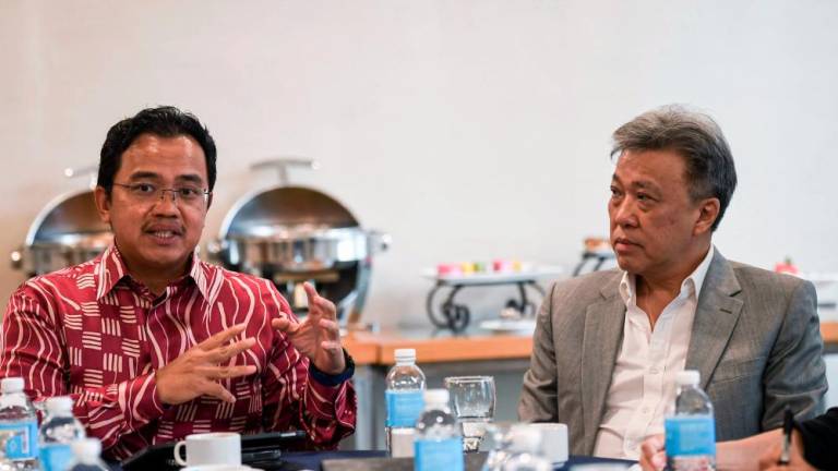 Malaysia Rail Link Sdn Bhd (MRL) chief executive officer Datuk Seri Darwis Abdul Razak (left) speaks during the East Coast Rail Link’s Moving Track forum here today/BERNAMApix