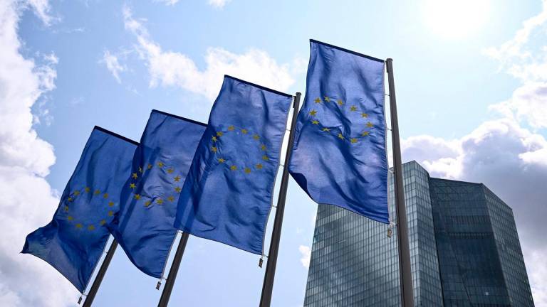 The EU flag flies in front of the European Central Bank (ECB) ahead a press conference on the Eurozone's monetary policy, in Frankfurt am Main, western Germany, on June 5, 2025. - Kirill KUDRYAVTSEV / AFP