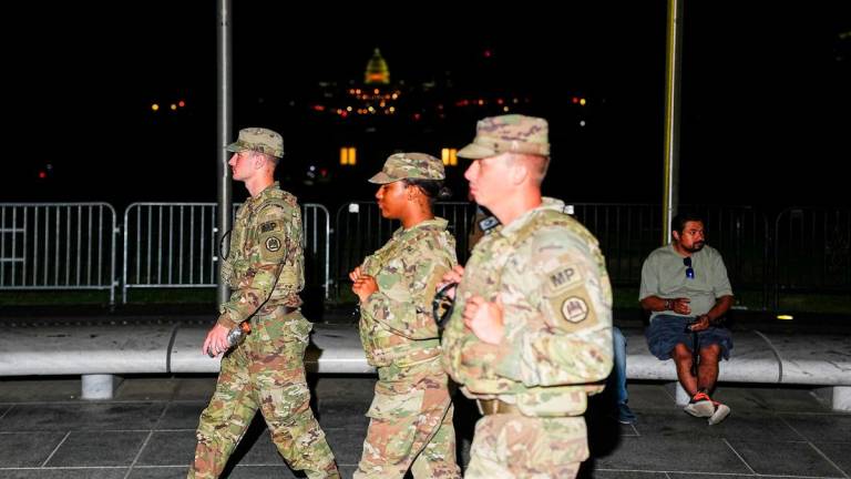 Members of the National Guard patrol the National Mall, after U.S. President Donald Trump deployed National Guard and ordered an increased presence of federal law enforcement to assist in crime prevention, in Washington, D.C., U.S., August 22, 2025. REUTERS/Aaron Schwartz
