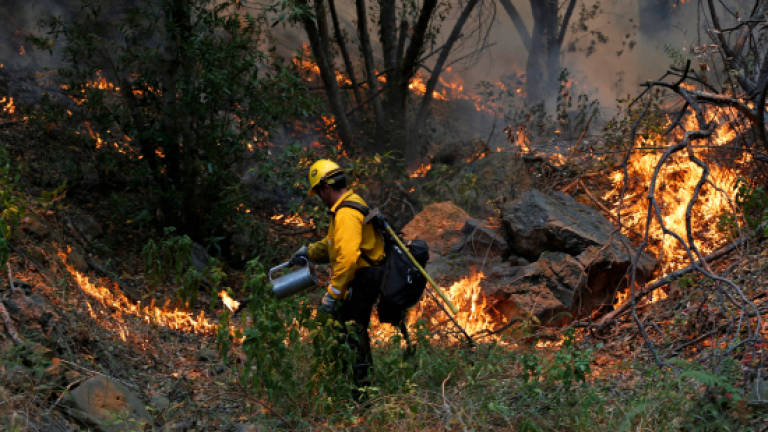 Fires Rage Across Western United States