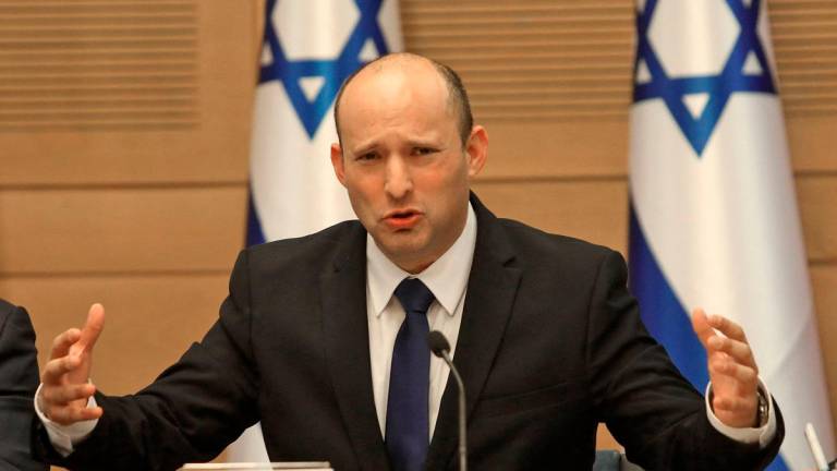 - Former Prime Minister Naftali Bennett gives an address at the Knesset in Jerusalem on June 13, 2021. / AFP / Gil COHEN-MAGEN
