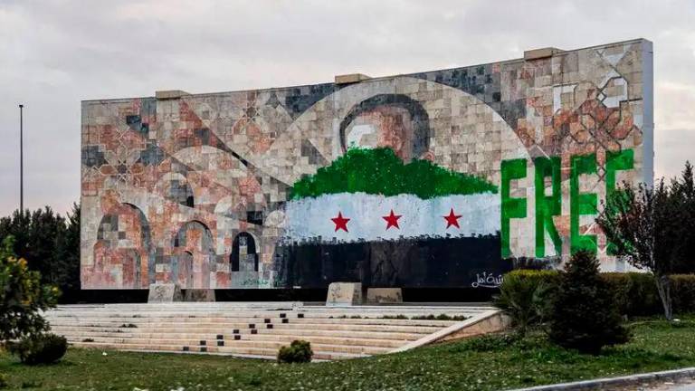 A picture of Syria’s first dictator, Hafez Assad, a member of the Alawite minority, was painted over after his son, Bashar, was ousted in December 2024Image: SAMEER AL-DOUMY/AFP/Getty Images