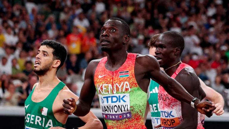 World Athletics Championships Tokyo 2025 - Men's 800m Final - Japan National Stadium, Tokyo, Japan - September 20, 2025Kenya's Emmanuel Wanyonyi crosses the line to win gold in the final ahead of Algeria's Djamel Sedjati who wins silver and Canada's Marco Arop who wins bronze - REUTERSPIX