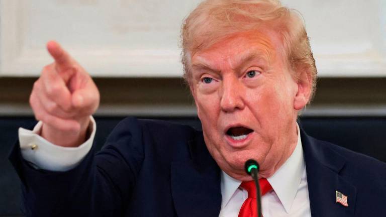 U.S. President Donald Trump points a finger as he speaks during a roundtable on antifa, an anti-fascist movement he designated a domestic “terrorist organization” via executive order on September 22, at the White House in Washington, D.C., U.S., October 8, 2025. REUTERS/Evelyn Hockstein