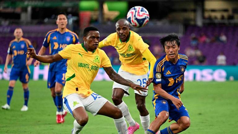 Ulsan Hyundai FC's South Korean midfielder #07 Ko Seungbeom (R), Sundowns' South African defenders #20 Grant Kekana and #25 Khuliso Mudau fight for the ball during the FIFA Club World Cup 2025 Group F football match between South Korea's Ulsan HD and South Africa's Mamelodi Sundowns at the Inter&amp;Co stadium in Orlando on June 17, 2025. - AFPPIX