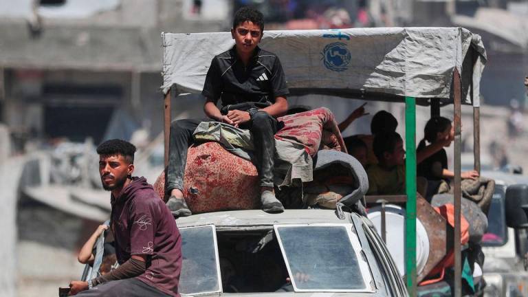 Displaced Palestinians make their way as they flee amid an Israeli military operation, in Gaza City, September 1, 2025. - REUTERSPIX