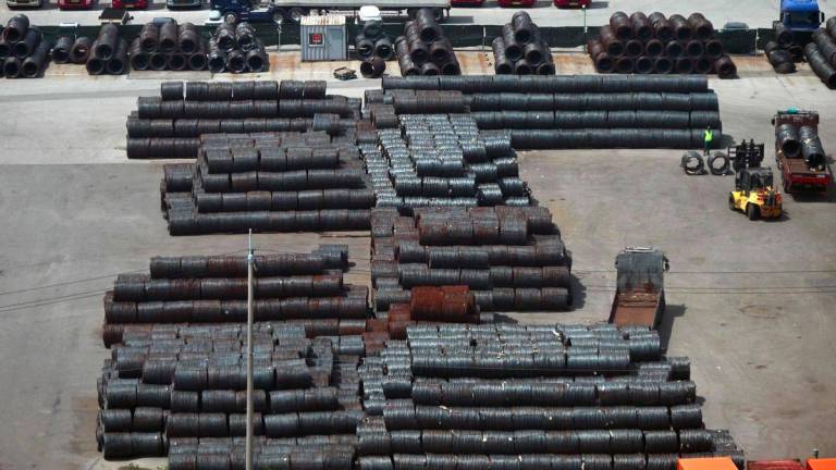 Steel coils are seen at a port in Pyeongtaek on July 31, 2025. US President Donald Trump said on July 30, that the United States will impose a 15 percent tariff on imports from South Korea, as he touted a full and complete trade deal between both countries. - AFPPIX