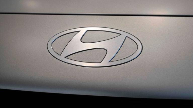 Hyundai Motor logo on the Ioniq 6 electric car at a dealership in Seoul - AFPpix