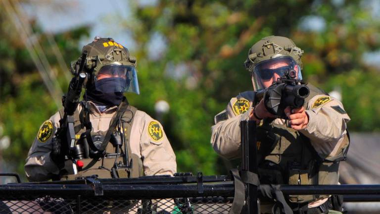 Members of law enforcement operate amidst a standoff between police and protesters following multiple detentions by Immigration and Customs Enforcement (ICE), in the Los Angeles County city of Paramount, California, U.S., June 7, 2025. REUTERSpix