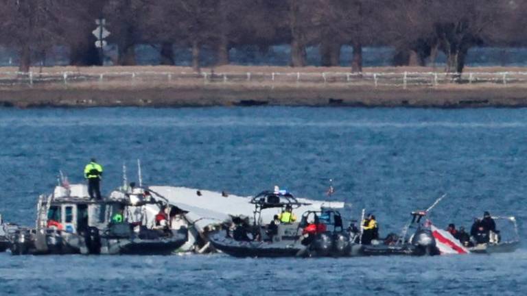 Pix for visual purposes. Emergency workers recover debris from the Potomac River in the aftermath of the collision of American Eagle flight 5342 and a Black Hawk helicopter, as seen from Virginia, U.S., January 30, 2025. REUTERSpix/Carlos Barria