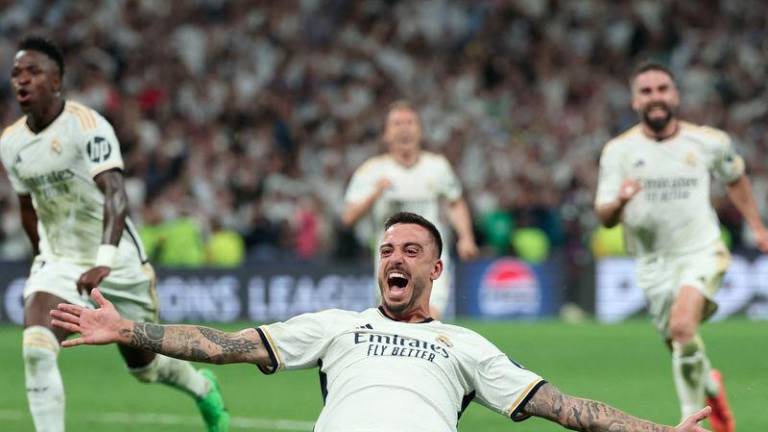 Real Madrid's Spanish forward #14 Joselu celebrates scoring during the UEFA Champions League semi final second leg football match between Real Madrid CF and FC Bayern Munich at the Santiago Bernabeu stadium in Madrid on May 8, 2024. - AFPPIX
