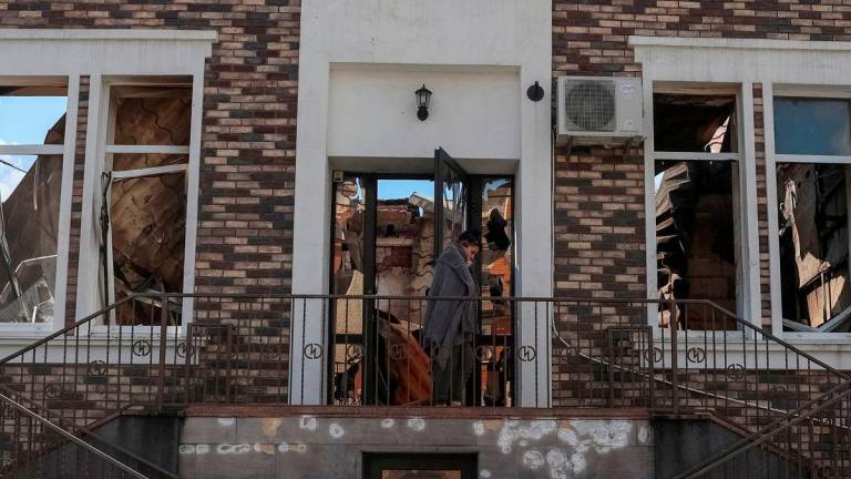 A resident is seen near a private clinic destroyed in the Russian drone and missile strike - Reuterspix