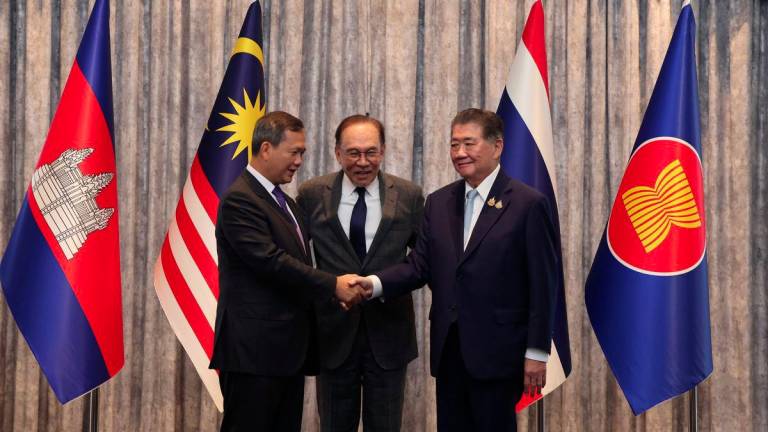 Prime Minister Datuk Seri Anwar Ibrahim (centre) witnesses Cambodian Prime Minister Hun Manet (left) shaking hands with Thailand's Acting Prime Minister Phumtham Wechayachai (right) following a Special Joint Meeting at the Seri Perdana Complex - BERNAMAPIX