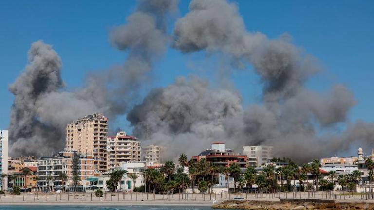 Smoke billows over the UNESCO-listed port city of Tyre after Israeli strikes, amid the ongoing hostilities between Hezbollah and Israeli forces, southern Lebanon October 23, 2024. - REUTERSPIX