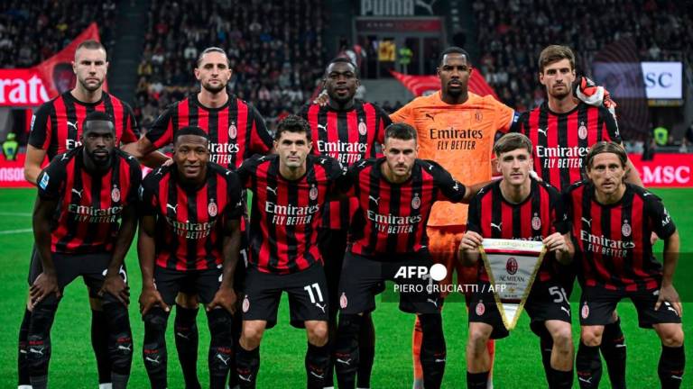 AC Milan's players pose for a photograph prior to the Italian Serie A football match between AC Milan and SSC Napoli at San Siro stadium in Milan, northern Italy, on September 28, 2025.- AFPPIX