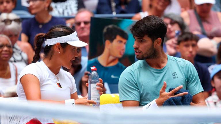 Britain’s Emma Raducanu and Spain’s Carlos Alcaraz during their round of 16 mixed doubles match against Britain’s Jack Draper and Jessica Pegula of the U.S. REUTERS/Mike Segar