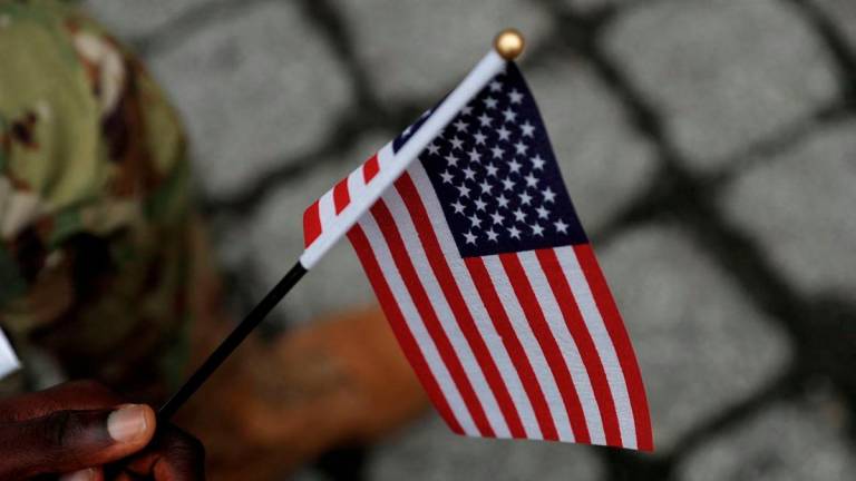 A U.S. Citizenship and Immigration Services (USCIS) naturalization ceremony in New York City, U.S., September 17, 2021. - REUTERS
