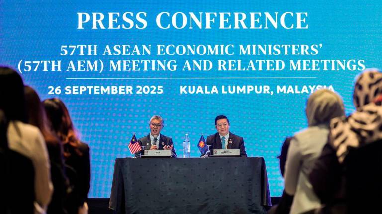 Minister of Investment, Trade and Industry Tengku Datuk Seri Zafrul Aziz (left) during the 57th AEM Meeting and Related Meetings press conference at the Malaysia International Trade and Exhibition Centre (MITEC) today. Also present ASEAN Secretary-General Dr Kao Kim Hourn (right).
