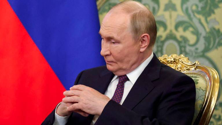 Russian President Vladimir Putin attends a meeting with Laotian President Thongloun Sisoulith at the Kremlin in Moscow, Russia, July 31, 2025. - REUTERSPIX
