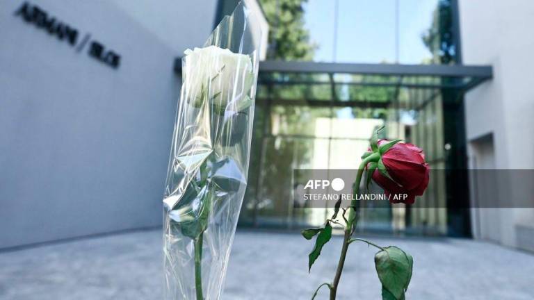 This picture shows two roses in front of Armani/Silos, a fashion art space dedicated to the Armani style, in Milan on September 5, 2025. - AFP