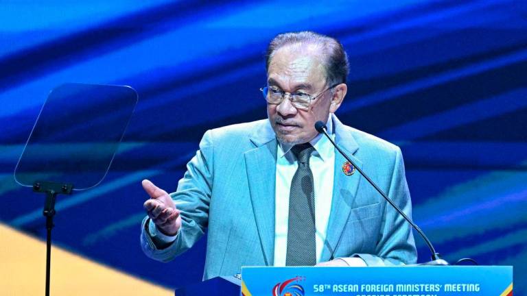 Prime Minister Anwar Ibrahim delivers his keynote address during the opening ceremony of the 58th Association of Southeast Asian Nations (ASEAN) Foreign Ministers’ meeting and related meetings at the Convention Centre in Kuala Lumpur on July 9, 2025. (Photo by MOHD RASFAN / AFP)