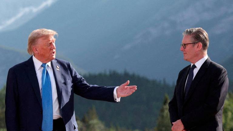 U.S. President Donald Trump and British Prime Minister Keir Starmer attend a photo session during the G7 Summit, in Kananaskis, Alberta, Canada, June 16, 2025. - REUTERSPIX