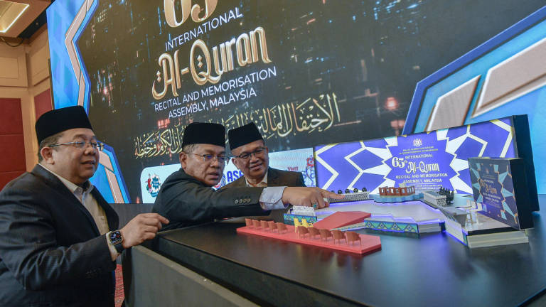 Minister in the Prime Minister’s Department (Religious Affairs), Datuk Dr Mohd Na’im Mokhtar (centre), witnesses the pre-launch gimmick of the 65th International Al-Quran Recitation and Memorisation Assembly (MTHQA) for the year 1447H/2027AD at the World Trade Centre Kuala Lumpur (WTCKL) on 14 July, 2025.