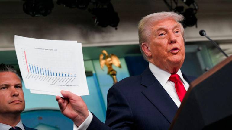 U.S. President Donald Trump speaks to the press about deploying federal law enforcement agents in Washington to bolster the local police presence, next to U.S. Defense Secretary Pete Hegseth, in the Press Briefing Room at the White House, in Washington D.C., U.S., August 11, 2025.- REUTERSPIX