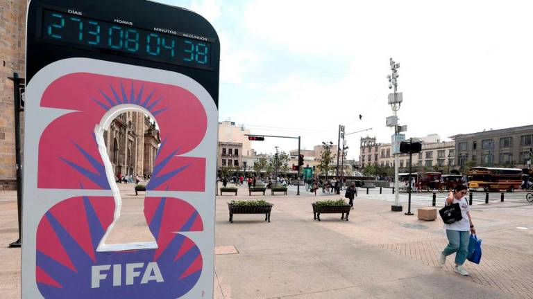 A woman walks past the FIFA World Cup 2026 countdown clock in Guadalajara, Jalisco state, Mexico on September 10, 2025. Registration is now open to participate in the ticket lottery for the 2026 FIFA World Cup, which will be held in Mexico, the United States, and Canada, with the opening match taking place at the Azteca Stadium in Mexico City on June 11, 2026. - AFPPIX
