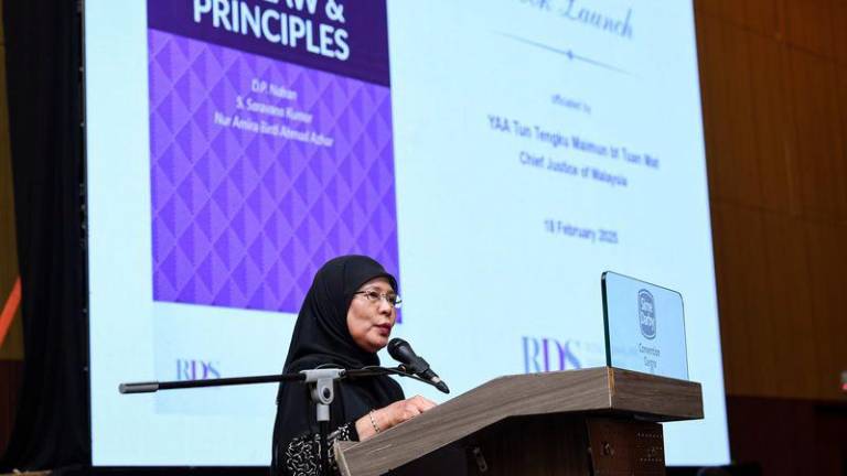 Chief Justice of Malaysia Tun Tengku Maimun Tuan Mat delivers her keynote address during the official launch of Malaysian Tax Law and Principles Book in conjunction with Rosli Dahlan Saravana Partnership (RDS) Legal and Tax Briefing 2025 at the Sime Darby Convention Centre (SDCC) on Tuesday (Feb 18). - BERNAMAPIX