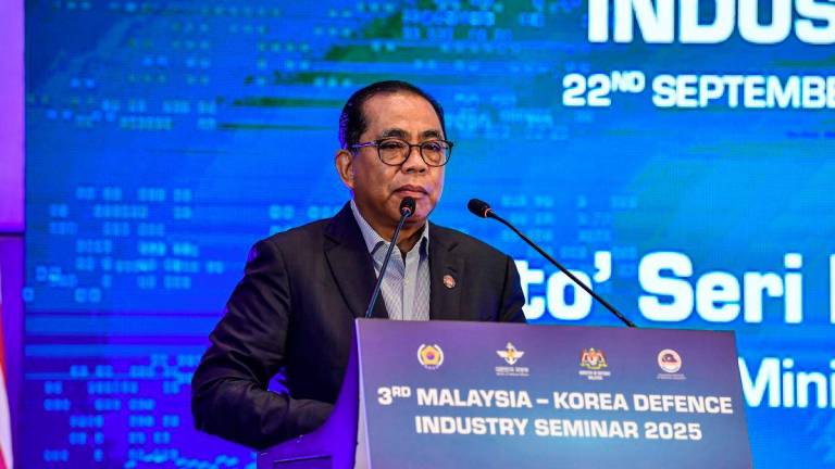 Defence Minister Datuk Seri Mohamed Khaled Nordin delivers a speech at the 3rd MalaysiaÐKorea Defence Industry Seminar 2025 today. - BERNAMA