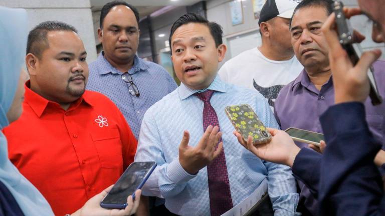 Wan Saiful (centre) speaking to reporters, alongside other division leaders, after appearing before the Disciplinary Board. – ADIB RAWI YAHYA/THESUN