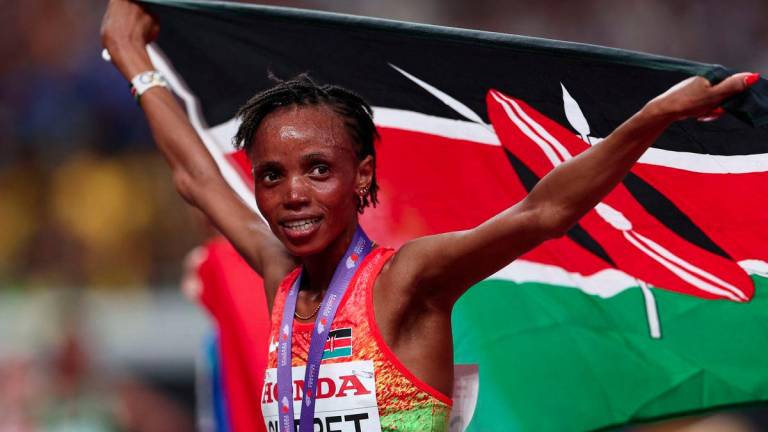 World Athletics Championships Tokyo 2025 - Women's 10,000m Final - Japan National Stadium, Tokyo, Japan - September 13, 2025 Kenya's Beatrice Chebet celebrates winning the women's 10,000m final - REUTERSPIX